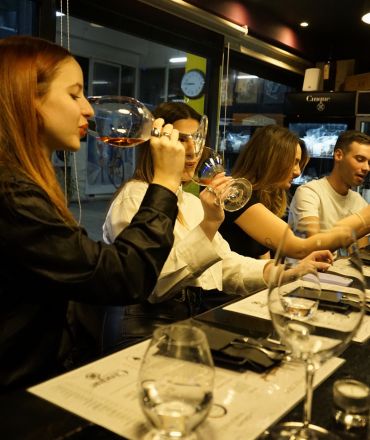 Greek wine tasting in Athens with guests tasting wine at Cinque Wine & Deli